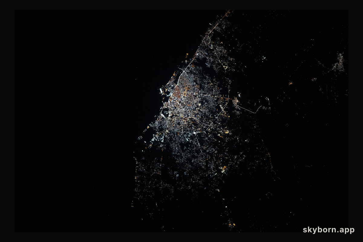Benghazi, Libya, shines with bright, modern city lights on the Mediterranean coastline