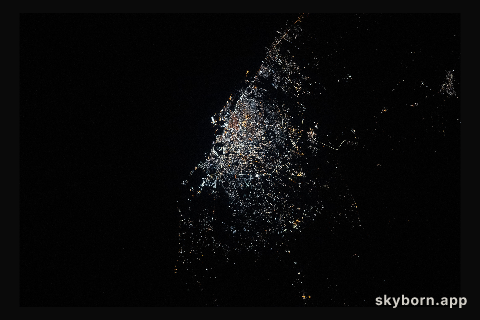 Benghazi, Libya, shines with bright, modern city lights on the Mediterranean coastline