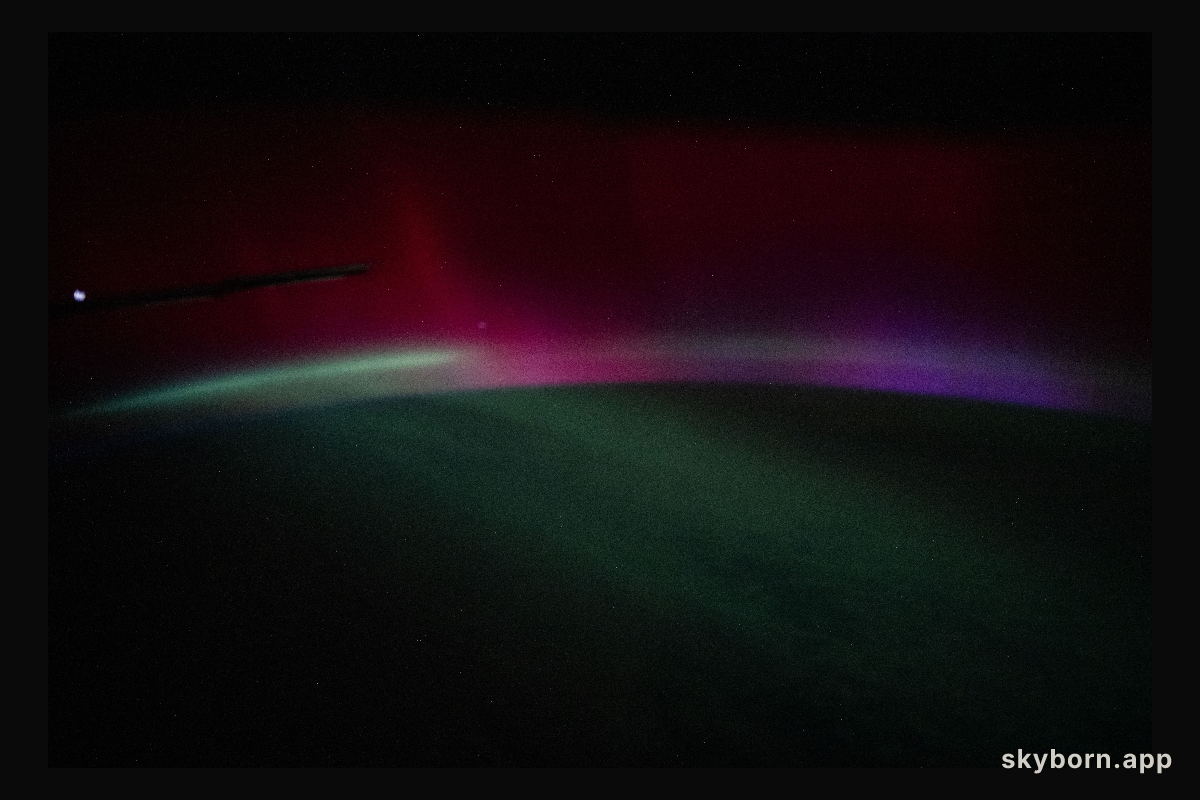 A wispy, multi-colored aurora created by a geomagnetic storm