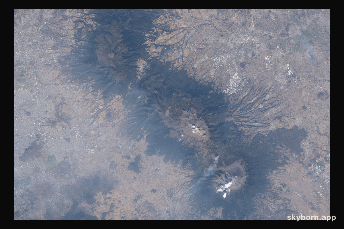 The three prominent mountaintops just east of Mexico City
