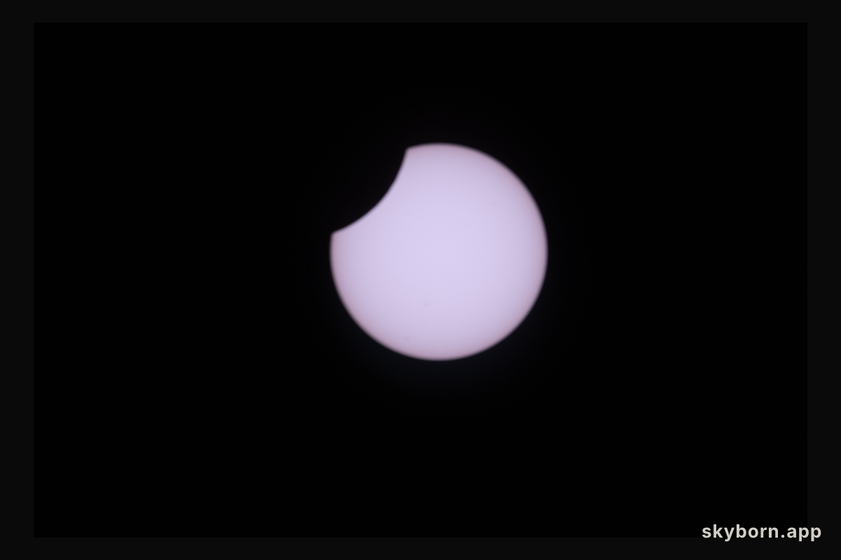 A partial solar eclipse is pictured from the International Space Station