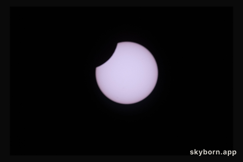 A partial solar eclipse is pictured from the International Space Station